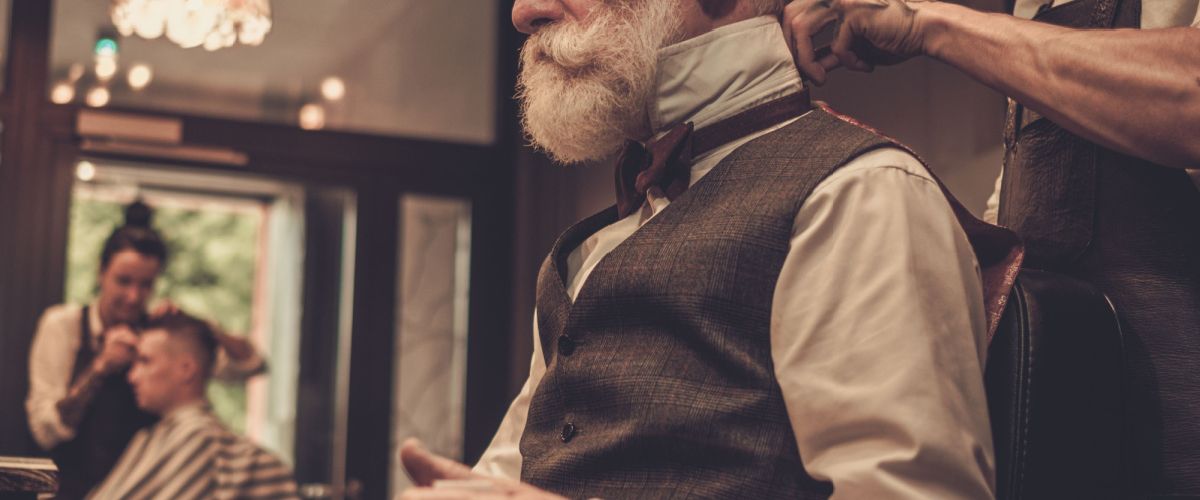 Distinguished gentleman gets his maintenance cut from his favorite Houston barber shop.